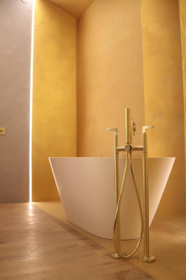 The Veil Hotel Astana Luaran gambar A modern freestanding bathtub