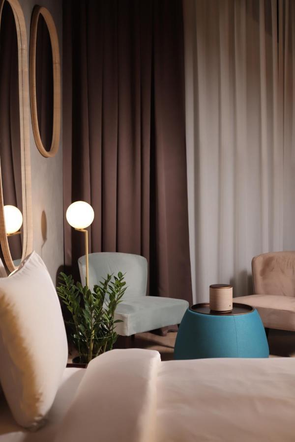 The Veil Hotel Astana Luaran gambar Curtains in a living room