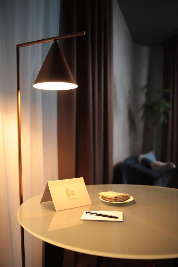 The Veil Hotel Astana Luaran gambar A floor lamp
